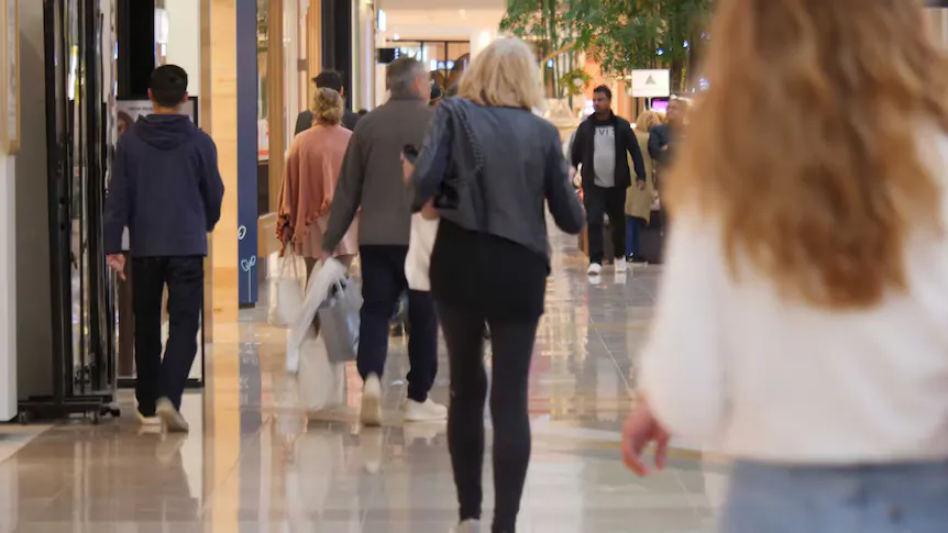 Pedestrians walking through an Australian city centre