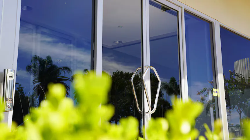 Aluminium window frames and glass panels at a building site