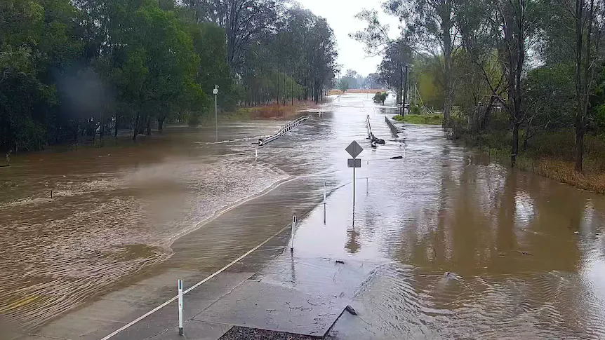 Rain clouds above a swollen river in rural Queensland