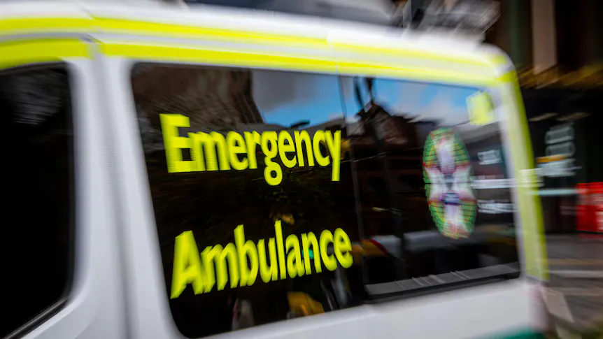 Ambulances parked outside a hospital emergency department