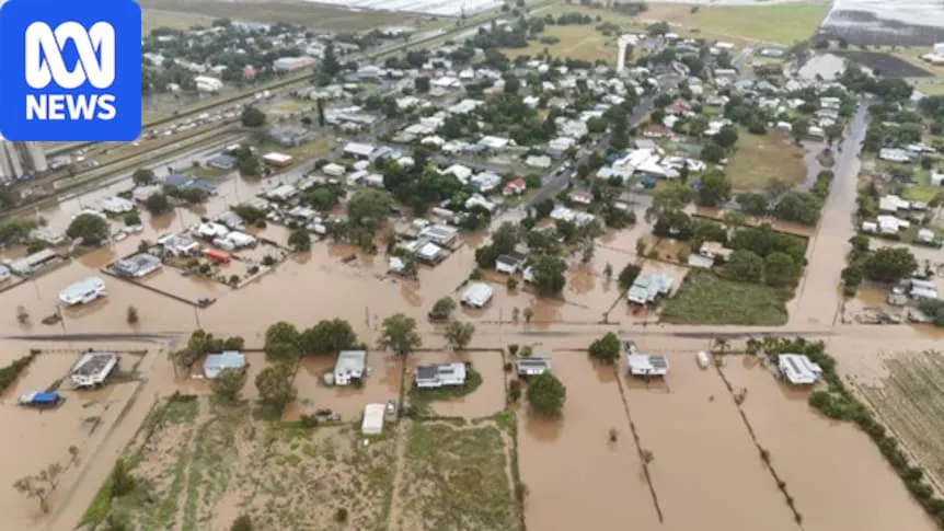 A flood-damaged road with barriers restricting access