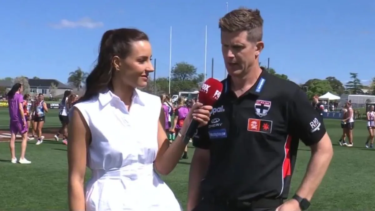 Australian rules football on grass beside boundary markings